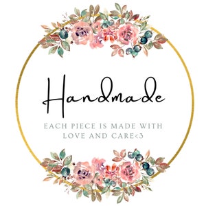 May include: A gold circle with a floral wreath around it. The wreath is made of pink and purple flowers, green leaves, and blue berries. The text "Handmade" is written in black cursive inside the circle. Below the text is the phrase "Each piece is made with love and care<3".