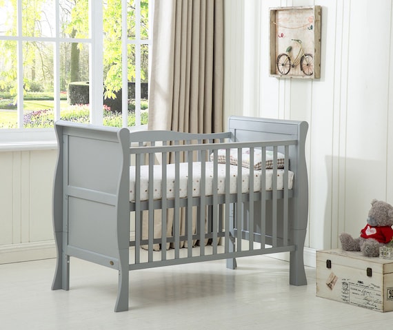 grey wooden cot