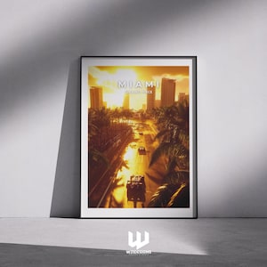 May include: Framed poster featuring a Miami Grand Prix scene. The artwork depicts race cars on a track with palm trees and city buildings under a golden sunset. The text "MIAMI GRAND PRIX" is visible.