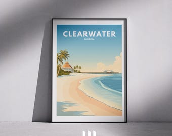 May include: A framed art print featuring a beach scene with the text "CLEARWATER FLORIDA" at the top. The artwork depicts a sandy beach, ocean, palm trees, and a pier under a blue sky.
