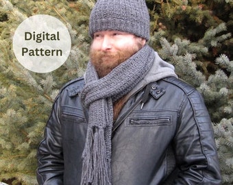 May include: A gray knitted hat and scarf set. The hat is a slouchy beanie style with a fold-over brim. The scarf is a long, rectangular shape with fringe at the ends.