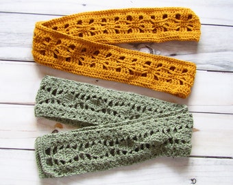 May include: Two crocheted headbands, one in a mustard yellow color and one in a sage green color. Both headbands have a lacy pattern.