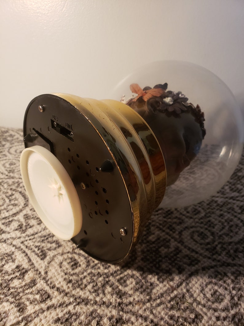 Trapped Musical Spinning Sculpture Globe