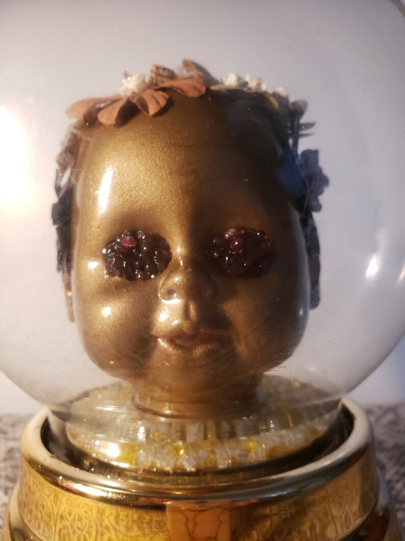 Trapped Musical Spinning Sculpture Globe