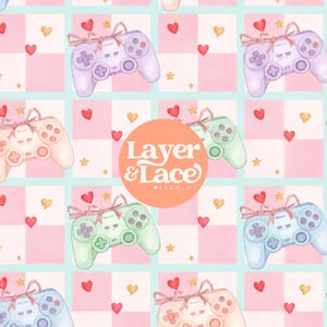 以下が含まれることがあります： リボンで飾られたパステルカラーのゲームコントローラーと、小さなハートや星がチェック柄の背景に繰り返されるパターン。中央のオレンジ色の円形ロゴには「Layer & Lace Studio」というテキストが表示されています。