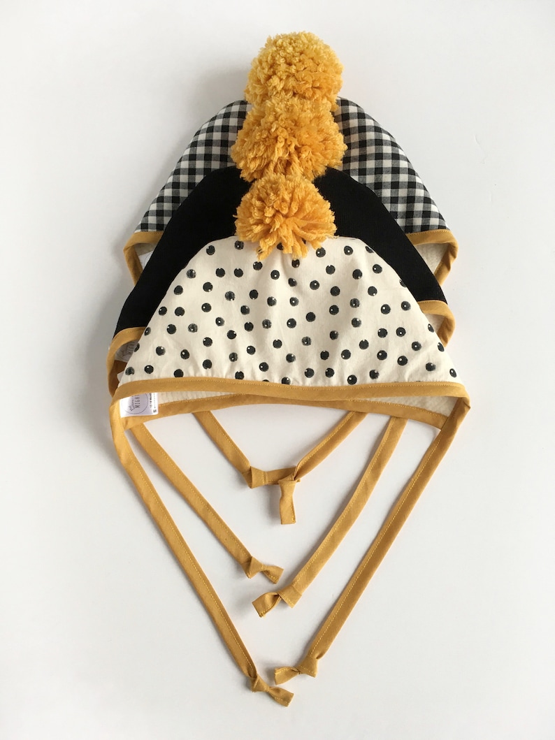Autumn Winter Bonnets Black and White Gingham Bonnet with Mustard Binding and matching Pom Pom Baby and Toddler Bonnets Handmade Bonnets
