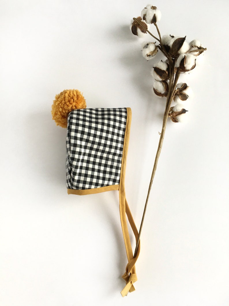 Autumn Winter Bonnets Black and White Gingham Bonnet with Mustard Binding and matching Pom Pom Baby and Toddler Bonnets Handmade Bonnets