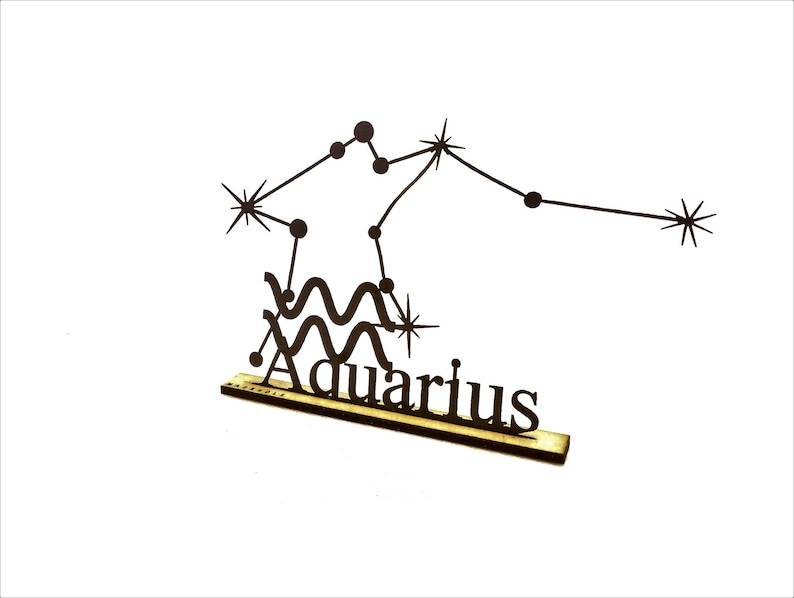 May include: Black wooden cutout of the Aquarius constellation with a stylized wave design and the word "Aquarius" below it.