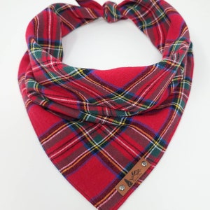May include: Red tartan dog bandana with a brown leather patch that says "Adventure Awaits".