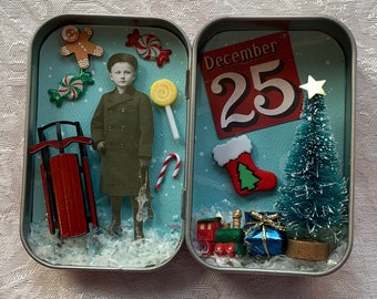 Christmas altered tin with boy and sled, Christmas tree with gifts