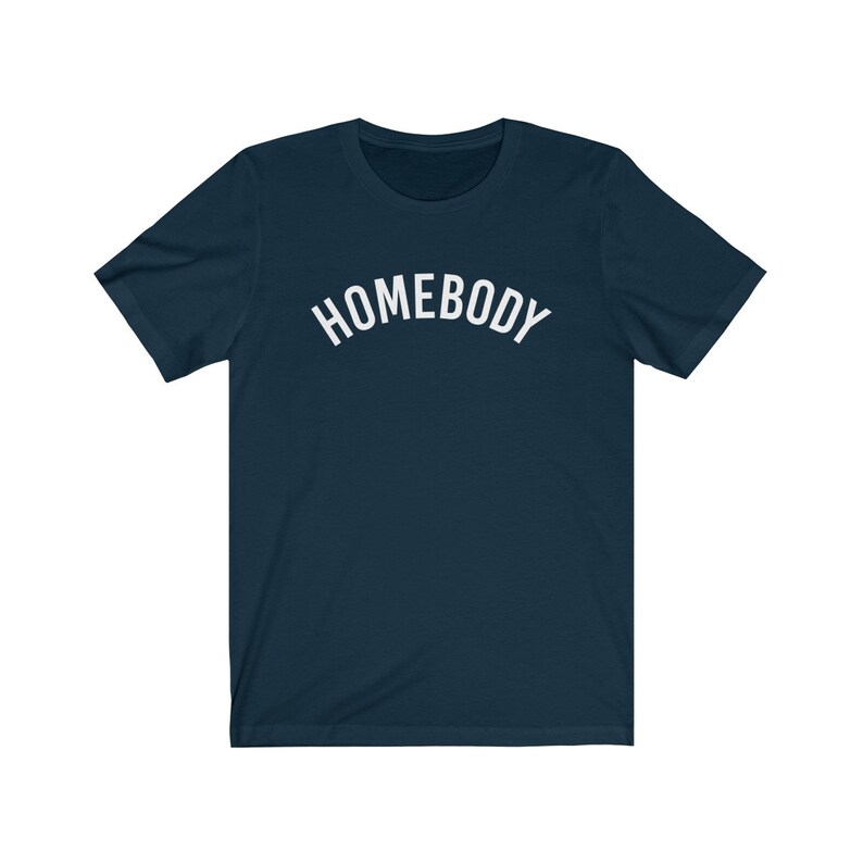 May include: A navy blue t-shirt with the word "HOMEBODY" printed in white on the front.