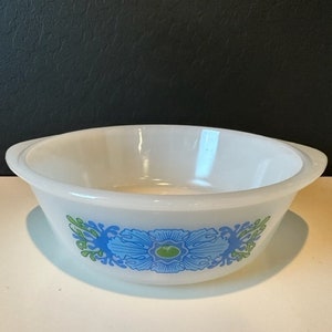 May include: White ceramic baking dish with a blue and green floral design.