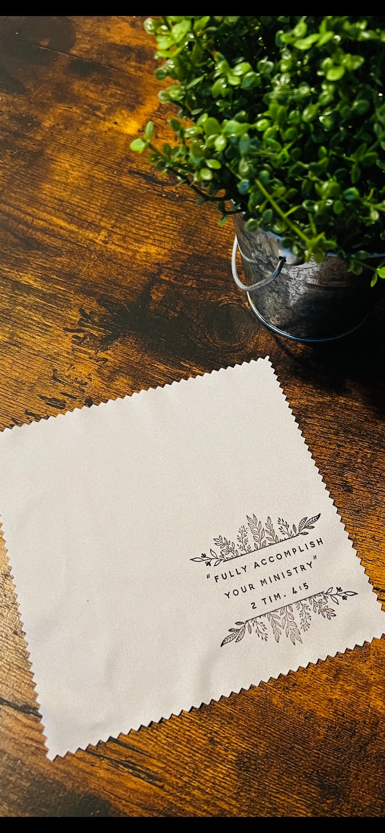 May include: White microfiber cleaning cloth with black floral border and the text "FULLY ACCOMPLISH YOUR MINISTRY" 2 TIM. 4:5
