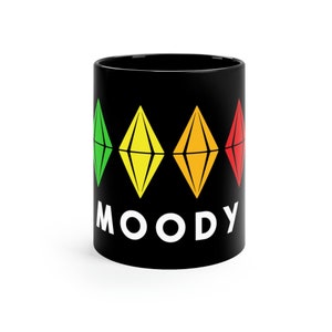 The Sims with the Moody Green Yellow Orange Red Plumbob 11oz Black Mug