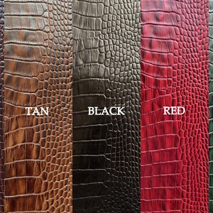 May include: Five different colored crocodile embossed leather swatches. The swatches are labeled "Brown", "Tan", "Black", "Red", and "Green".