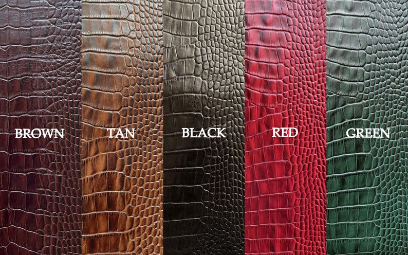May include: Five different colored crocodile embossed leather swatches. The swatches are labeled "Brown", "Tan", "Black", "Red", and "Green".