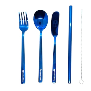 May include: A set of blue reusable cutlery with a matching blue straw and a cleaning brush. The cutlery includes a fork, spoon, and butter knife. The set is branded with "Conscious Cutlery".