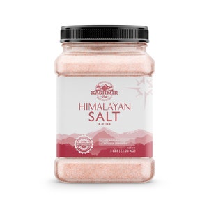 May include: A clear plastic jar filled with pink Himalayan salt. The label reads "Kashmir Pink Himalayan Salt X-Fine" and includes a red seal that says "Authentic". The label also states "All Natural Kosher Certified" and "Net Wt 5 lbs (2.26 kg)".