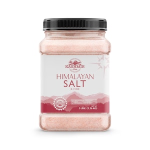 May include: A clear plastic jar filled with pink Himalayan salt. The label reads "Kashmir Pink Himalayan Salt X-Fine" and includes a red seal that says "Authentic". The label also states "All Natural Kosher Certified" and "Net Wt 5 lbs (2.26 kg)".