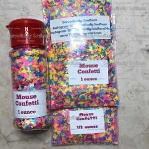 May include: Three containers of colorful mouse confetti. The containers are labeled "Mouse Confetti" and include the size in ounces. The largest container is 1 ounce, the medium container is 1 ounce, and the smallest container is 1/2 ounce.