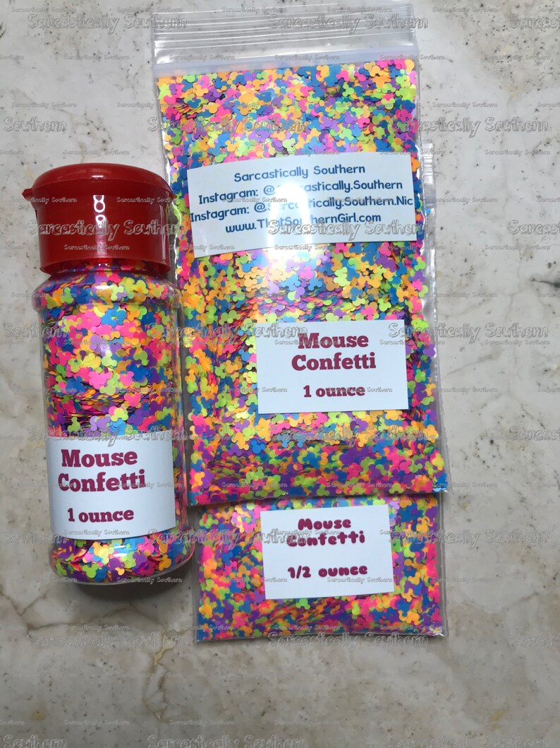 May include: Three containers of colorful mouse confetti. The containers are labeled "Mouse Confetti" and include the size in ounces. The largest container is 1 ounce, the medium container is 1 ounce, and the smallest container is 1/2 ounce.