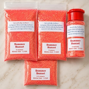 May include: Three clear plastic bags and one clear plastic shaker bottle filled with bright orange Summer Sunset glitter. Each container features a white label with the text Summer Sunset, weight in ounces, and a glitter size of 1/128 inch.