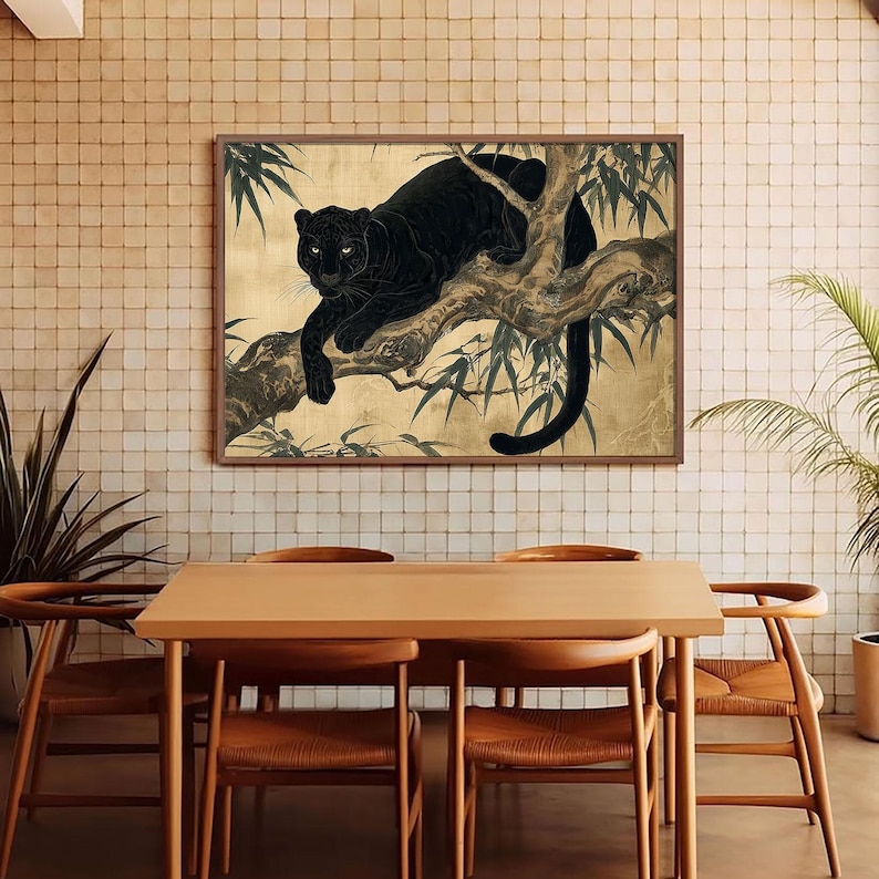 May include: A framed art print depicts a black panther resting on a tree branch. The artwork features a gold background with bamboo leaves and a dark brown frame. The panther's fur is a deep black, and its eyes are visible.