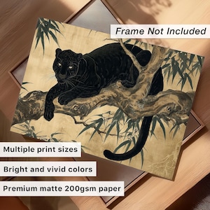 May include: A black panther print on a beige background, resting on a tree branch with green leaves. The artwork has bright and vivid colors and is printed on premium matte 200gsm paper. The print is available in multiple sizes.