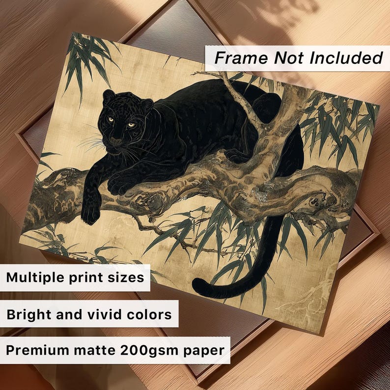 May include: A black panther print on a beige background, resting on a tree branch with green leaves. The artwork has bright and vivid colors and is printed on premium matte 200gsm paper. The print is available in multiple sizes.