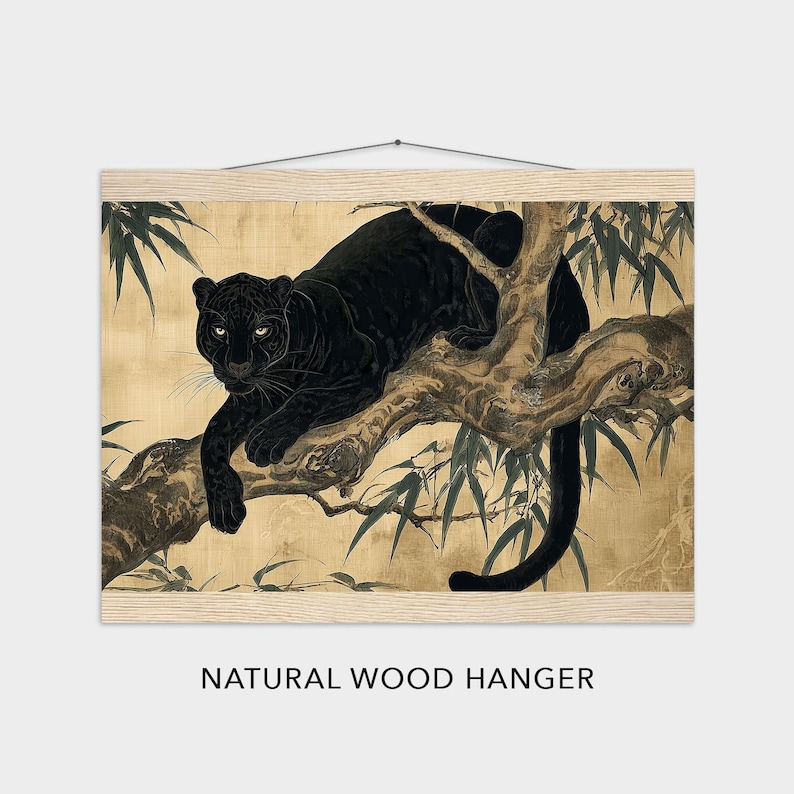 May include: A black panther rests on a tree branch in this art print. The artwork is mounted on a natural wood hanger. The background is a golden color with bamboo leaves. The panther's fur is a deep black, and its eyes are focused.