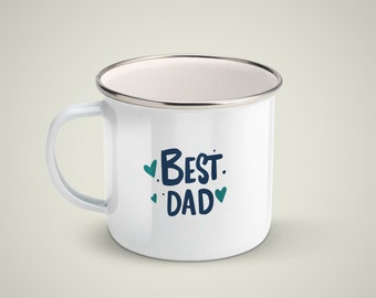 May include: White enamel mug with a silver rim and a blue and black inscription that reads "Best Dad" with small hearts around the text.