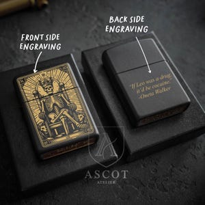 May include: Two matte black metal lighters. The left lighter features a gold-toned engraving of a skeleton wearing a crown on a throne with the text LEO. The right lighter features a gold-toned engraving with the text If Leo was a drug, it'd be cocaine. -Oneta Walker.