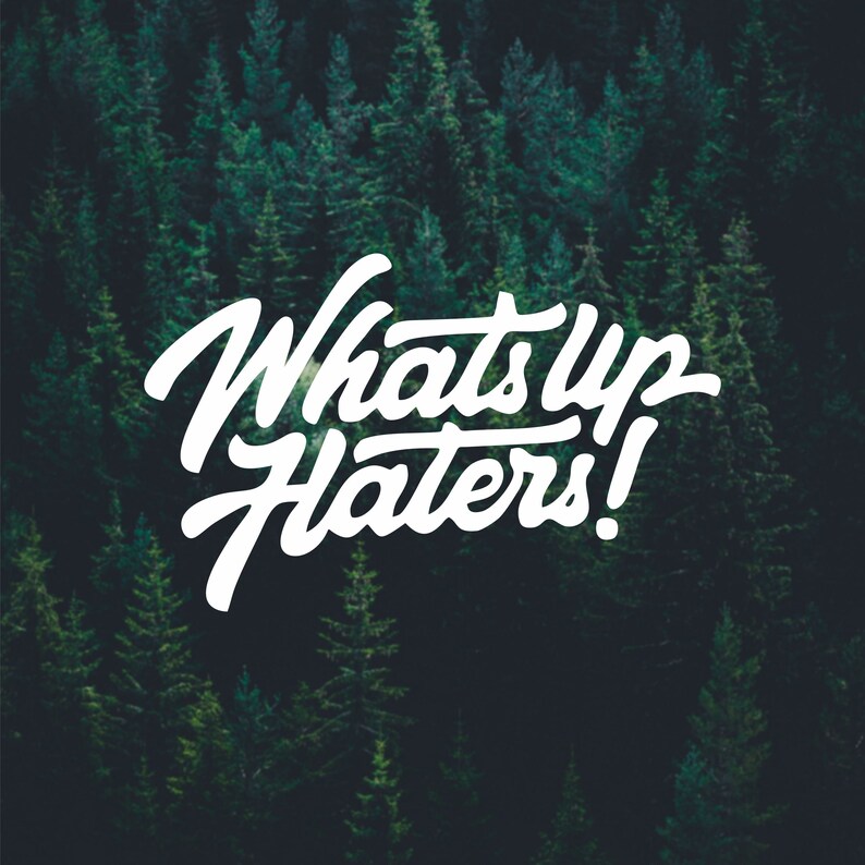 May include: White text on a dark green background reads "What's Up Haters!" The text is in a stylized font.
