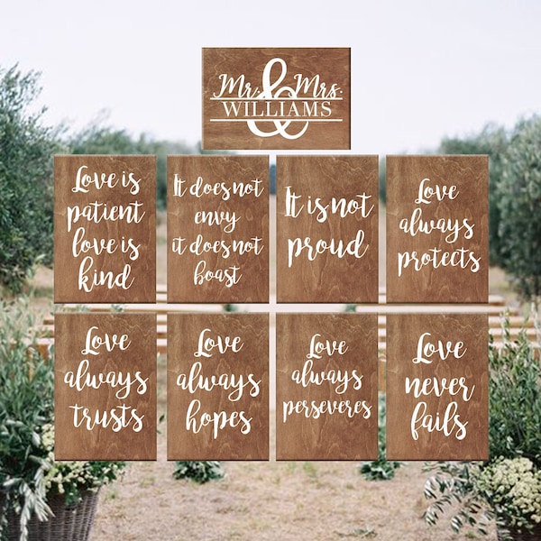 Rustic set of wooden planks for garden wedding ceremony decoration Love is patient love is kind