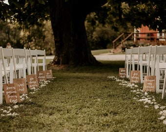 A set of wedding ceremony wooden decorative boards with a quote from the bible letter to the 1 Corinthians 13