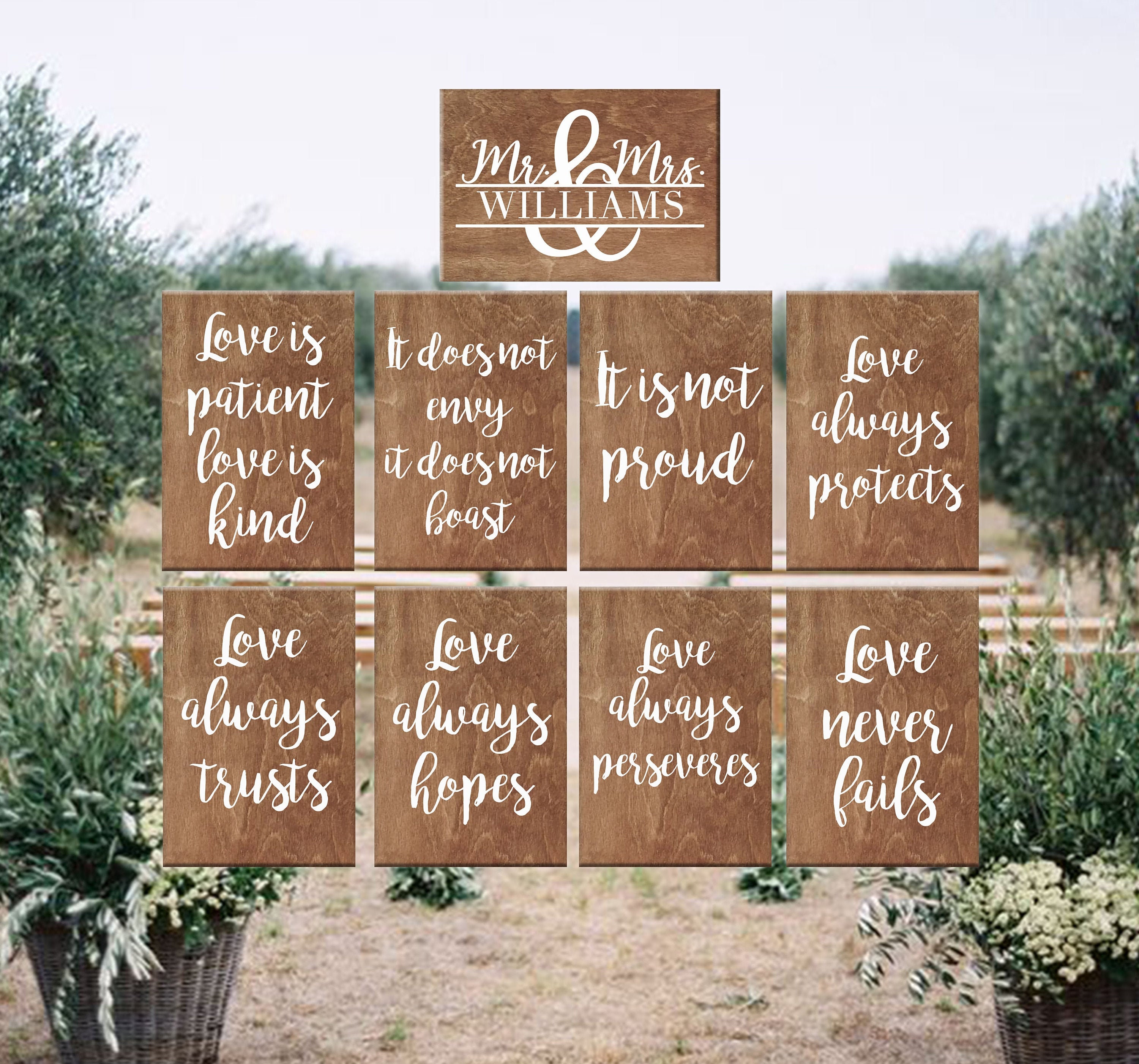 Rustic set of wooden planks for garden wedding ceremony decoration Love is patient love is kind
