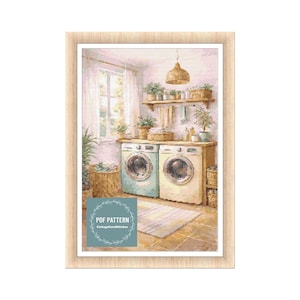 May include: A framed print of a laundry room scene. Two vintage-style washing machines are side-by-side. The room is decorated with plants, a woven light fixture, and a rug. The print has a soft, watercolor aesthetic. The text "PDF PATTERN" and "CottageCoreStitches" is visible.