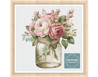 May include: A cross stitch pattern featuring a bouquet of pink roses in a clear glass jar. The pattern is titled "PDF Pattern CottageCoreStitches".