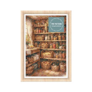 May include: A framed cross-stitch pattern depicts a rustic pantry filled with jars, baskets, and shelves. The image features a variety of preserved foods and produce, with the text "PDF PATTERN" and "CottageCoreStitches" in a circular design.