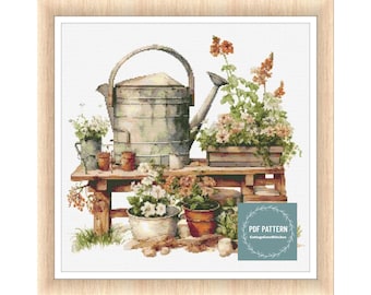 May include: A vintage watering can, wooden bench, and potted plants with flowers in shades of pink, white, and orange. The scene is set against a white background. The text "PDF PATTERN CottageCoreStitches" is in the lower right corner.