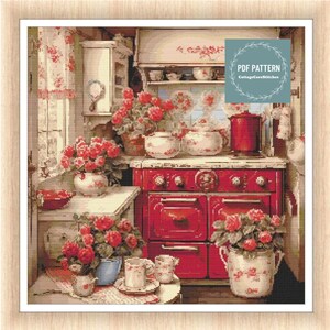 May include: A vintage red stove with a white countertop and floral accents. There are several potted plants with red flowers, and a collection of teacups and saucers on the counter. The text "PDF PATTERN CottageCoreStitches" is in a circle on the right side of the image.