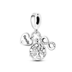 May include: Silver charm with a heart that says "Family", a tree of life design with clear crystals, and an infinity symbol with clear crystals.