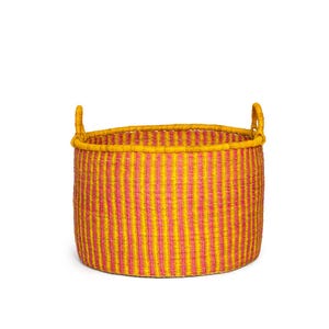 May include: A large, round storage basket with two handles. The basket is woven from natural materials and has a yellow and pink striped pattern.