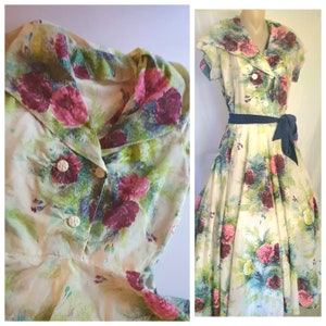 Beautiful 1950s dress in striking floral carnation print. Alteration to waist noted. 38/30