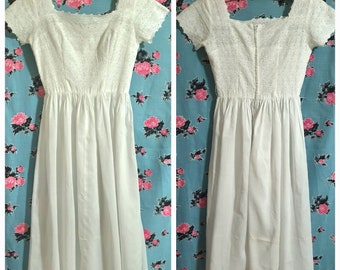 Beautiful 1950s white cotton dress with broderie lace bodice. Size small.