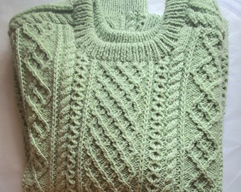 Beautiful soft pastachio green wool Aran style handknit sweater. Size Small - Medium.
