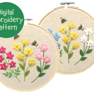 May include: Two round embroidery hoops with floral designs. One hoop features red, yellow, and pink flowers with bees. The other hoop has yellow, blue, and white flowers with bees. The text "Digital Embroidery Pattern" is in a green circle.