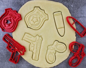 Police themed cookie cutters: Pistol, Police badge, Handcuffs, Pistol bullet