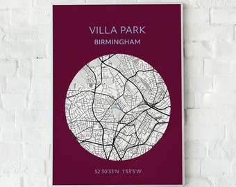 May include: A framed map print of Villa Park, Birmingham, in a circular design. The map is in grayscale, set against a deep burgundy background. The text "VILLA PARK BIRMINGHAM" is at the top, with coordinates at the bottom.