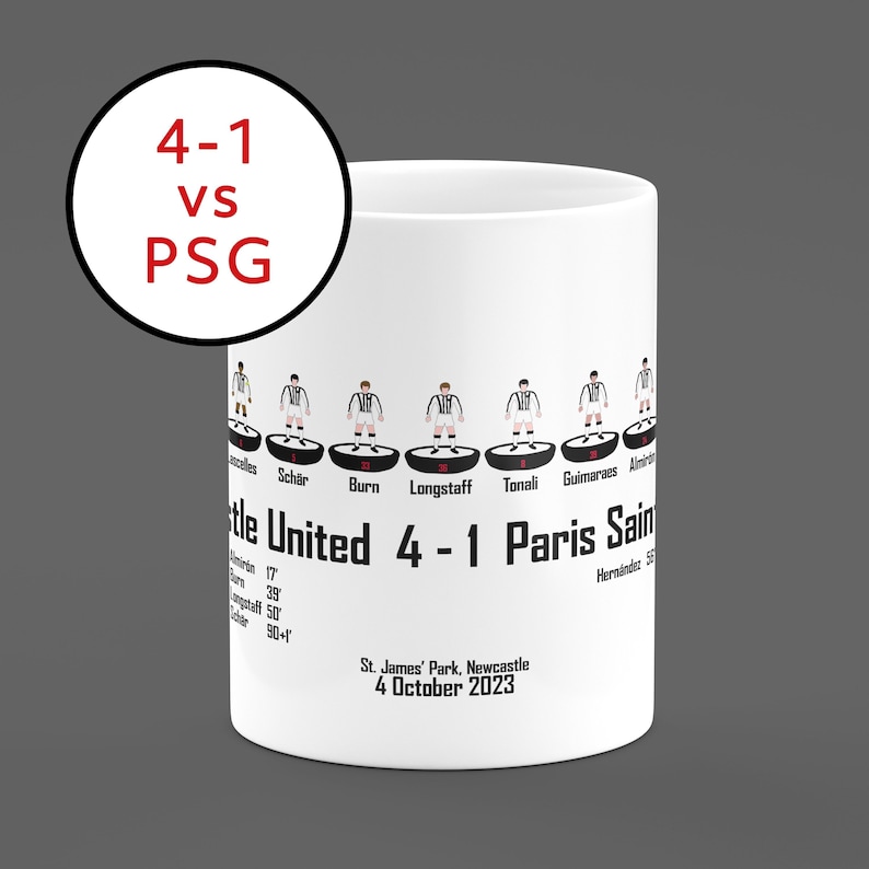 May include: White ceramic mug with a black and white illustration of a soccer game between Newcastle United and Paris Saint-Germain. The score is 4-1 in favor of Newcastle United. The text "St. James' Park, Newcastle 4 October 2023" is printed below the illustration.